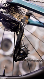 Bikone Forged Carbon Pulley Wheels, installed on a road bike with cassette and chain in view, road bike drivetrain components